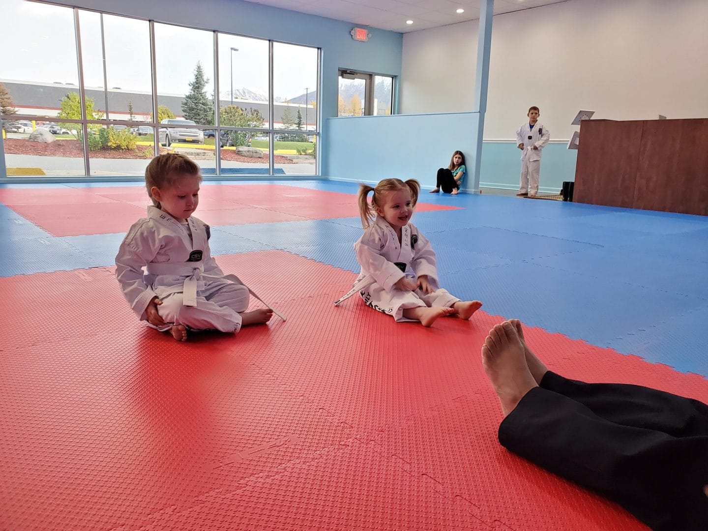 Two young students having fun learning from instructor