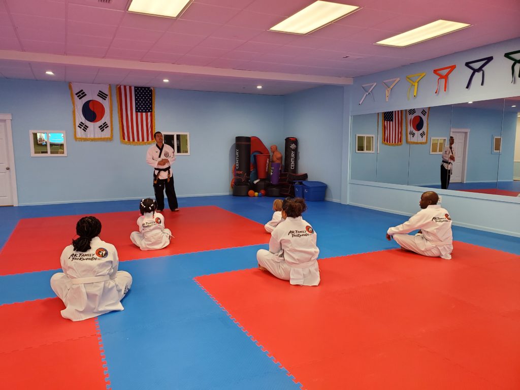 Master Brandon Lee instructing students while they sit